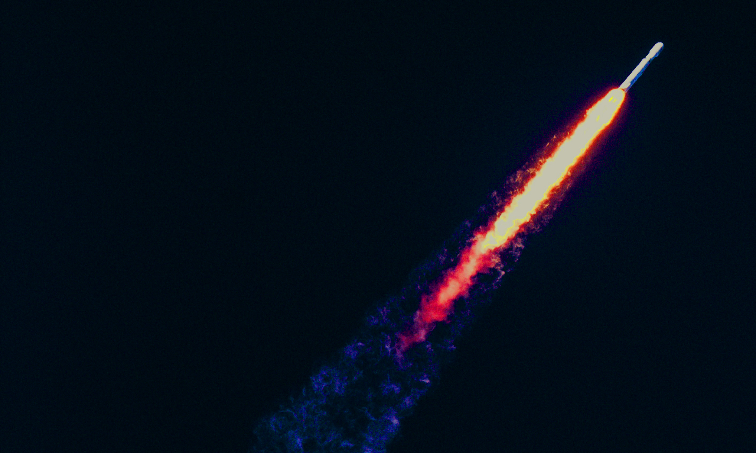 Space rocket blasting through the earth’s atmosphere
