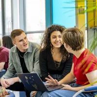 Modern Language students sharing laptop